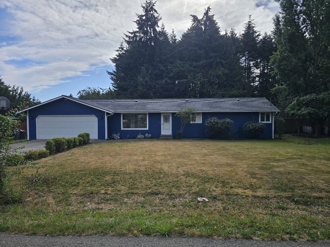 Finished navy blue exterior repaint on a peninsula home